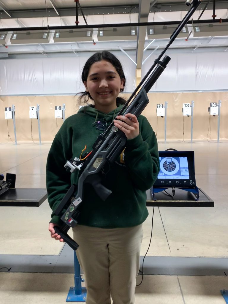 Abril DeCastro poses with her sporter air rifle.