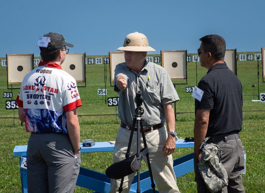 Col Kitchens explains the stance for pistol shooting to students.