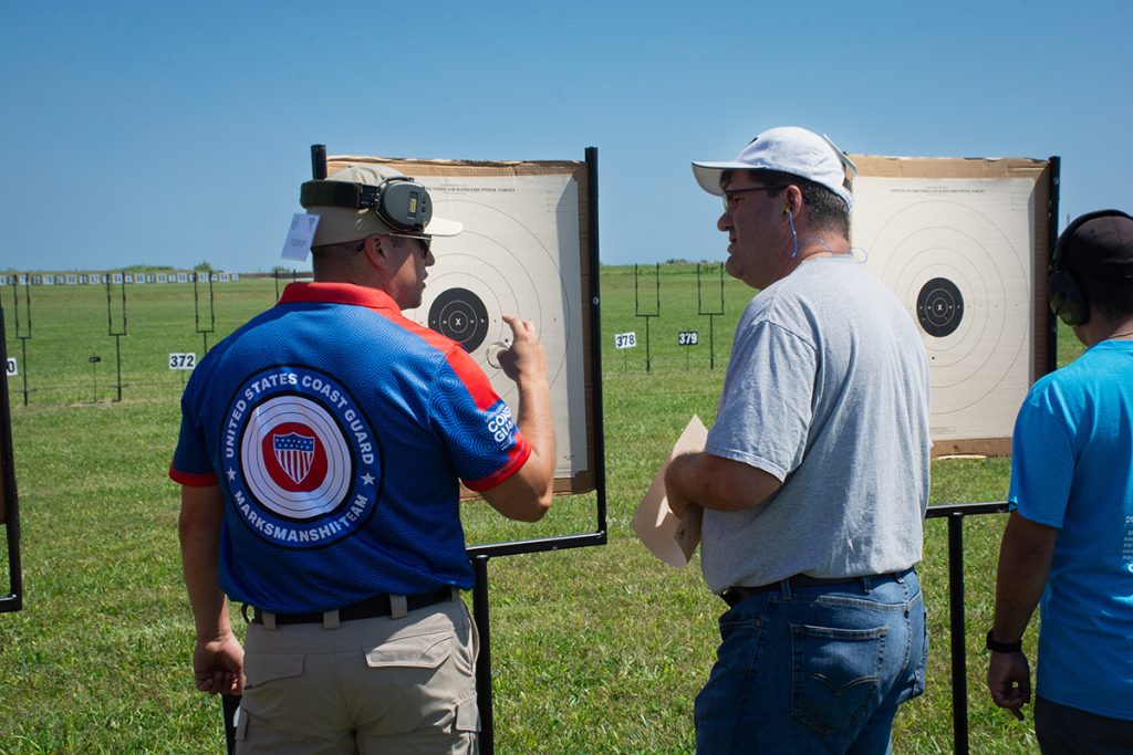 Students go downrange to view the targets with their instructors.