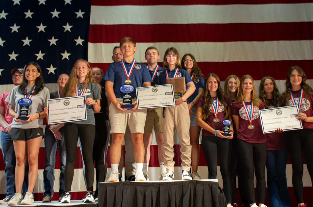 The top 3 teams in the CMP Precision Air Rifle Championship with plaques.