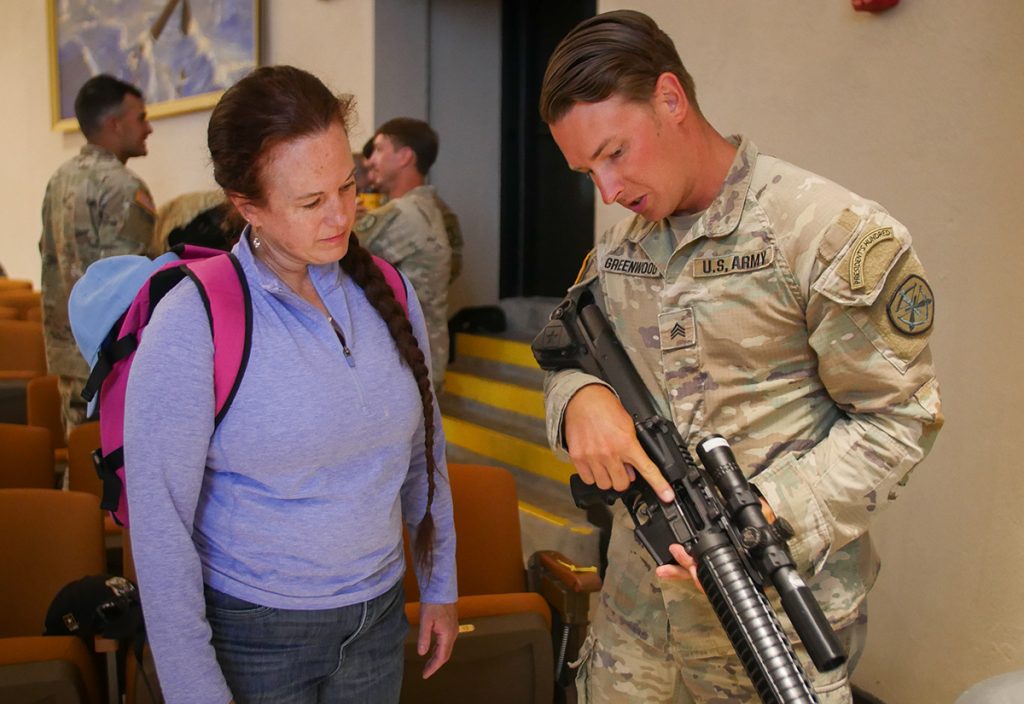 During the classroom portion of the SAFS, SGT Forrest Greenwood, USA, explains the AR-15 rifle to a student.