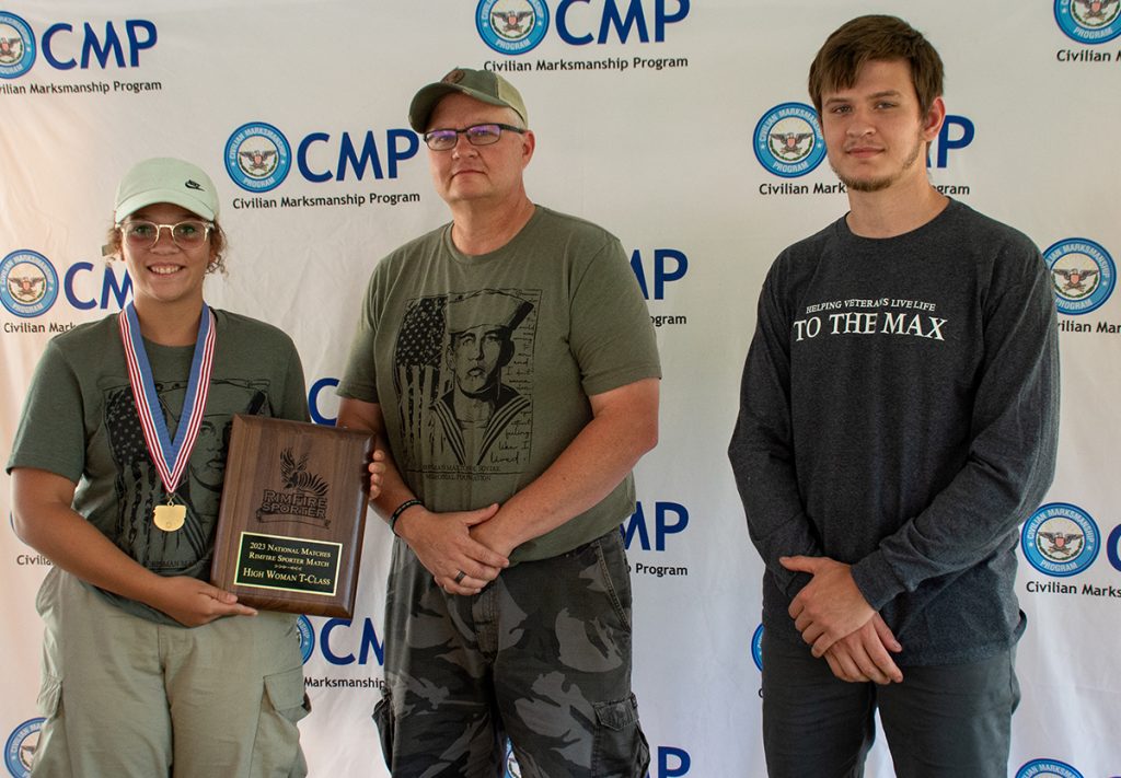 Jenna Boykin, High T-Class Woman, with award plaque.