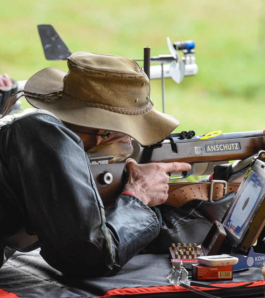 Competitor firing rifle.