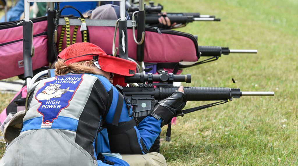 A junior from the Illinois Junior Highpower team takes a shot from the sitting position.