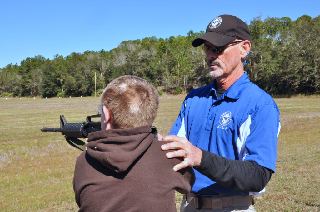 Danny Arnold instructing junior competitor.