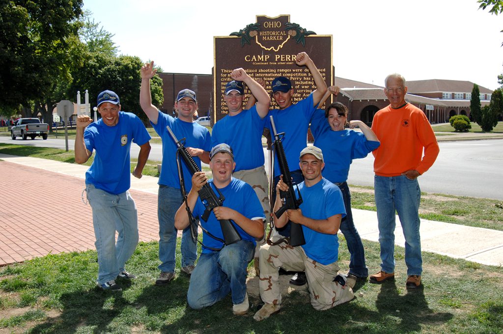 California Grizzlies team pose together for photo.