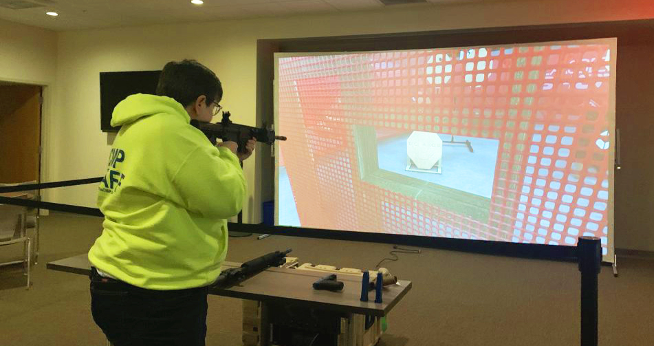 Competitor aiming at the Laser Shot Simulator.