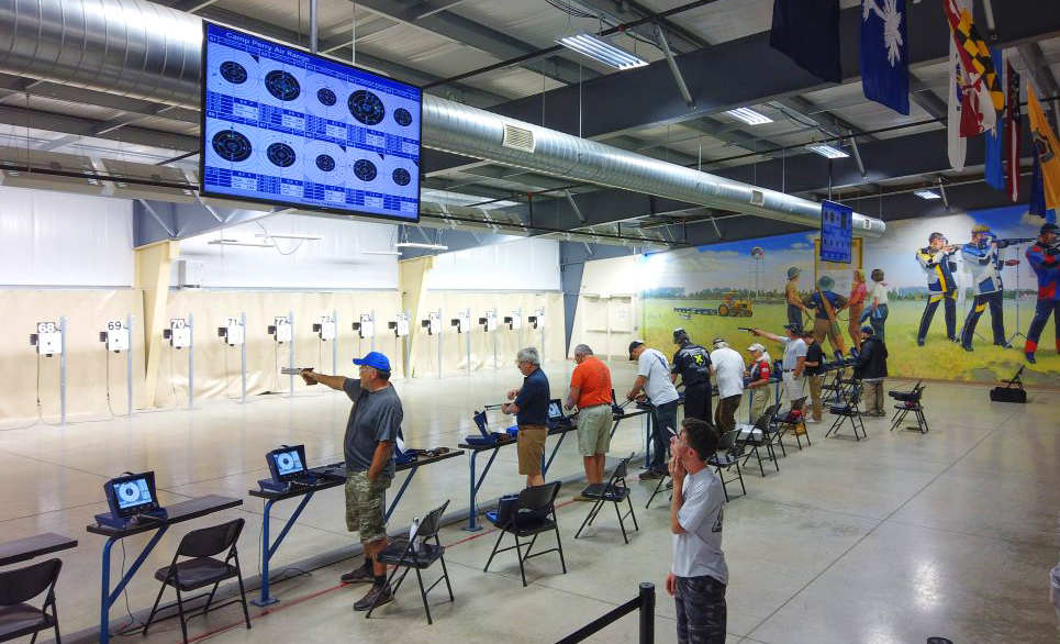 Air pistol competitors on the firing line.
