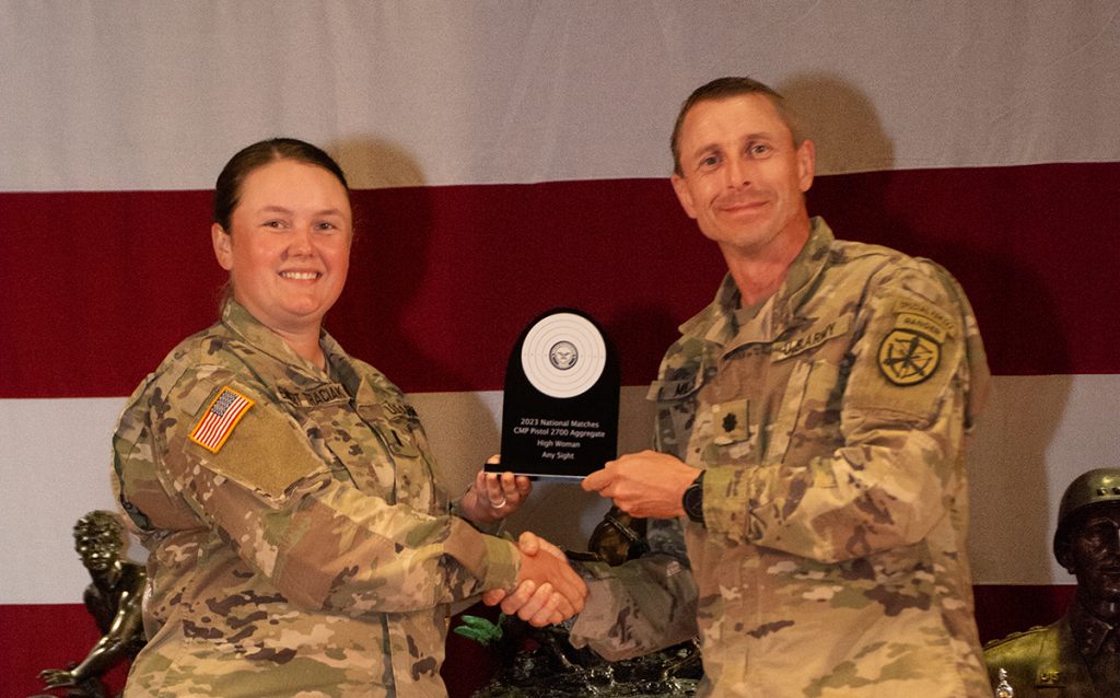 Emmert Traciak with award plaque from the Any Sight High Woman 2700 Aggregate.