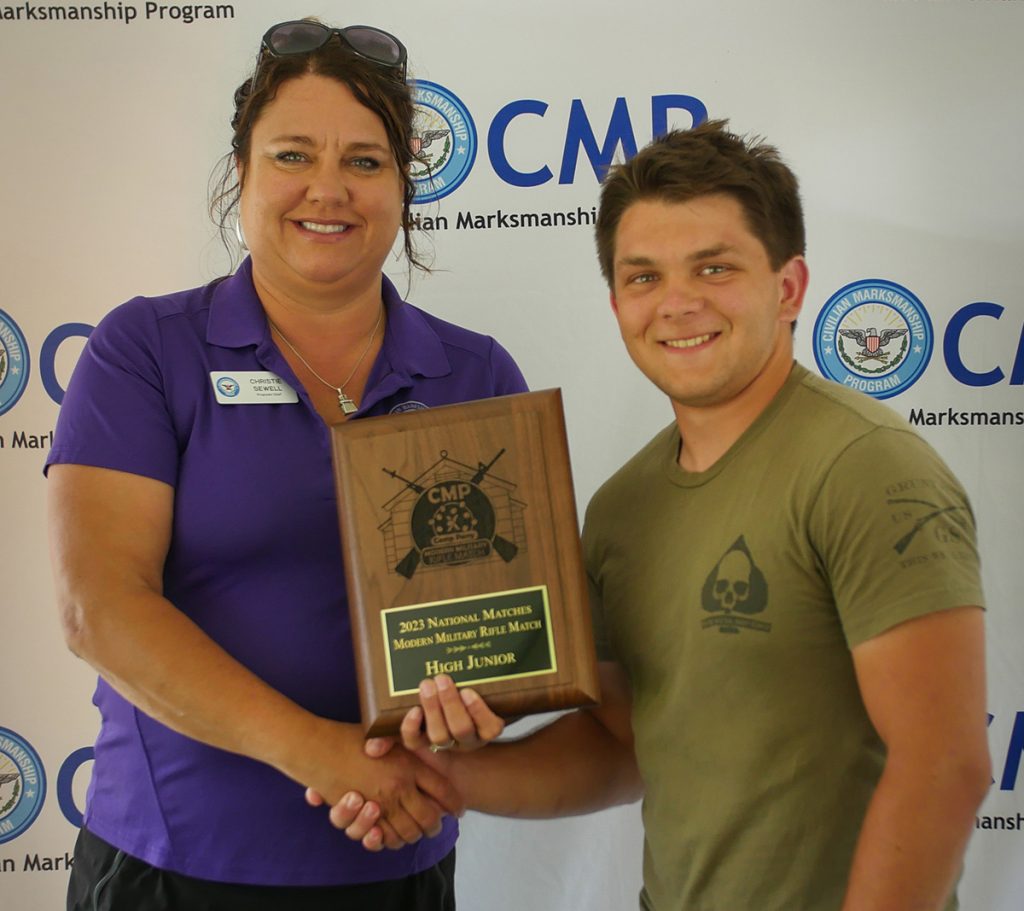 Raymond Allen with  Modern Military High Junior award plaque.