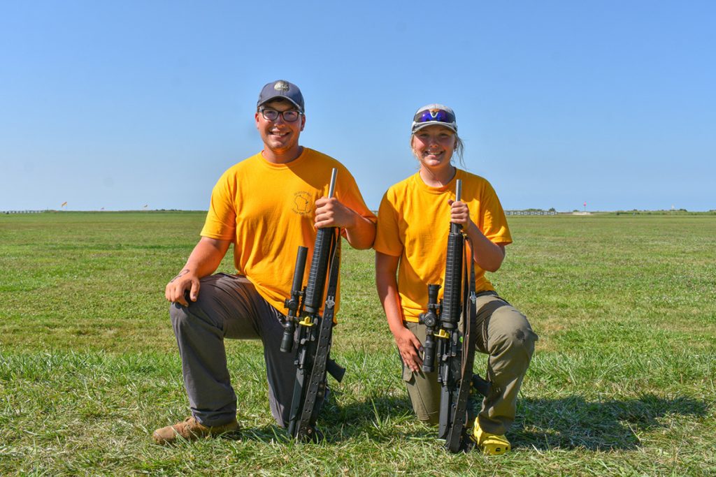 Thomas and Kacie McGowan pose with rifles.