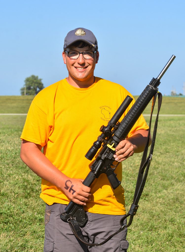 Thomas pose with rifle.