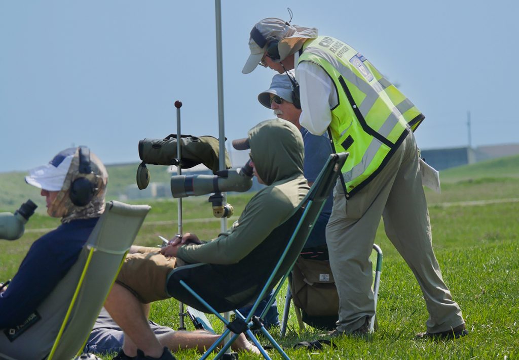 Bruce helps to assist competitors on the firing line.