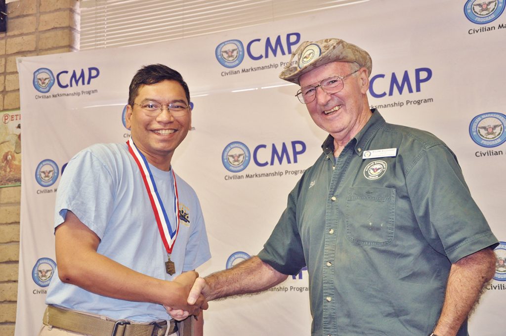 Willoughby awarding medal to a CMP Games competitor.