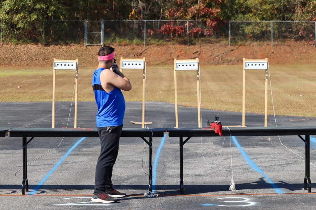 Competitor taking a shot during the Target Sprint event.