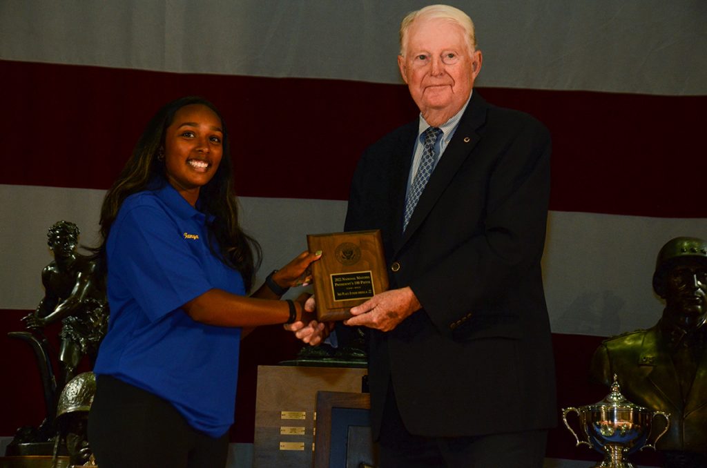 Tanya receives an award plaque during the CMP's National trophy Pistol Awards Ceremony.