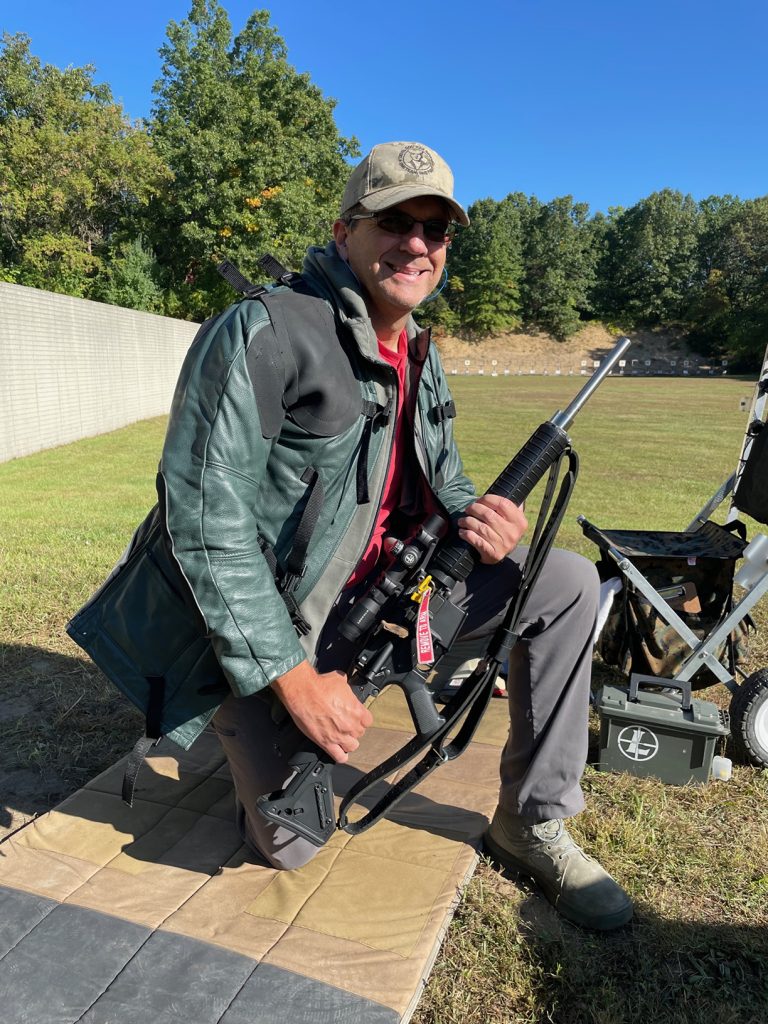 Bryan Scott poses with rifle on the range.