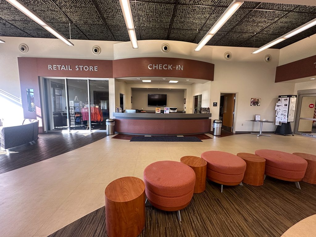 The entrance to the Gary Anderson CMP Competition Center features a check-in area and CMP merchandise store.