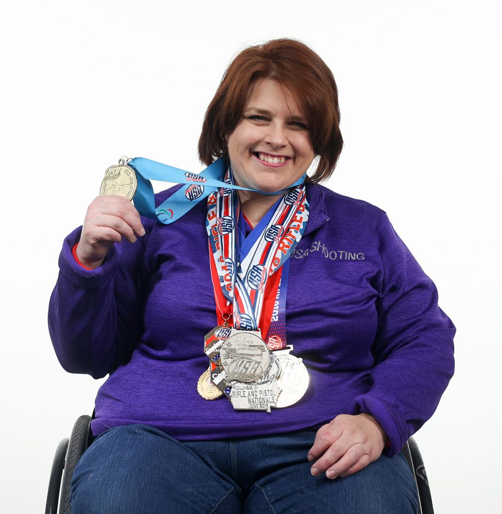 Jazmin Almlie-Ryan wearing several medals she has won.