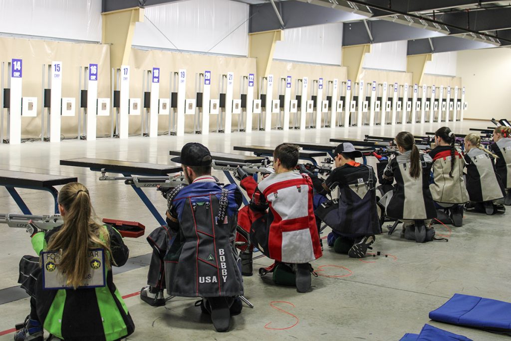 Athletes in the kneeling position on the firing line at the Gary Anderson CMP Competition Center.