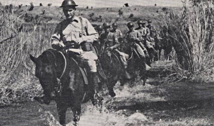 Captain John Wheeler leading the Machine Gun Troop of the 26th Cavalry Regiment(PS)(Horse) just prior to the Japanese invasion. From the cover of the March/April, 1943 issue of "The Cavalry Journal." Photo courtesy of the Philippine Scouts Heritage Society