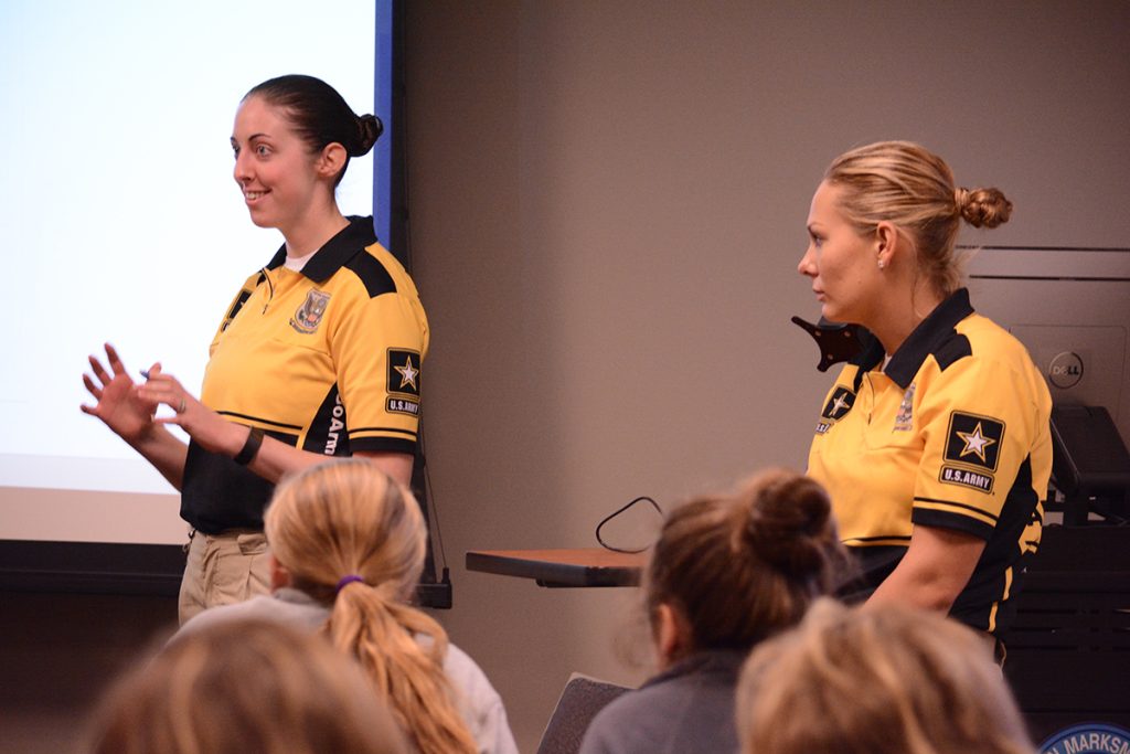 Army Marksmanship Unit members SPC Erin McNeil (left) and Larissa Wright (right) helped conduct a clinic for junior shooters during the Camp Perry Open. SSG George Norton was also present to answer questions and give advice to the young marksmen in attendance.