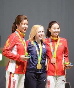 The first gold medalist in the 2016 Rio de Janeiro Olympic Games was the USA’s Virginia Thrasher. The 19-year-old athlete from Virginia and West Virginia University is shown with her Olympic gold medal (center) and the silver and bronze medalists, who are both from China. Thrasher began as an active 3-position air rifle shooter.