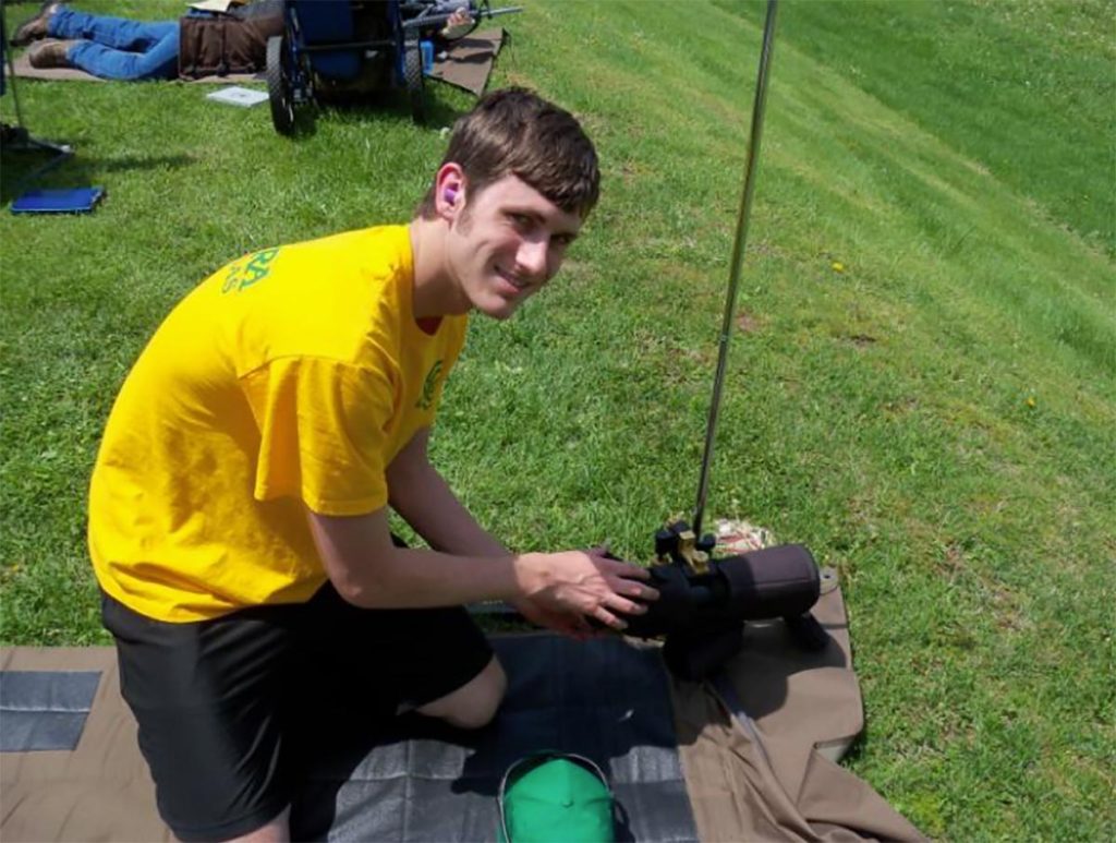 Aaron McGovern, a junior on the Millcreek Rifle Club Junior HP Team, fondly remembers watching his coach receive a Distinguished Rifleman Badge at the 2014 National Matches, saying, “He made us all proud.”