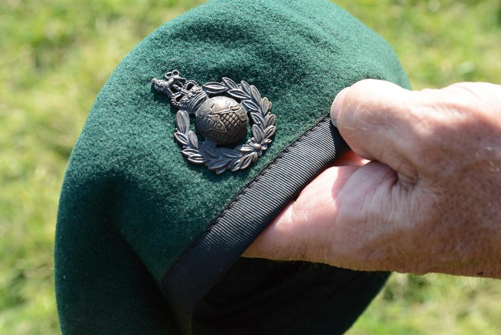 The intricate British emblem on the beret features Africa, Europe and the far east. 