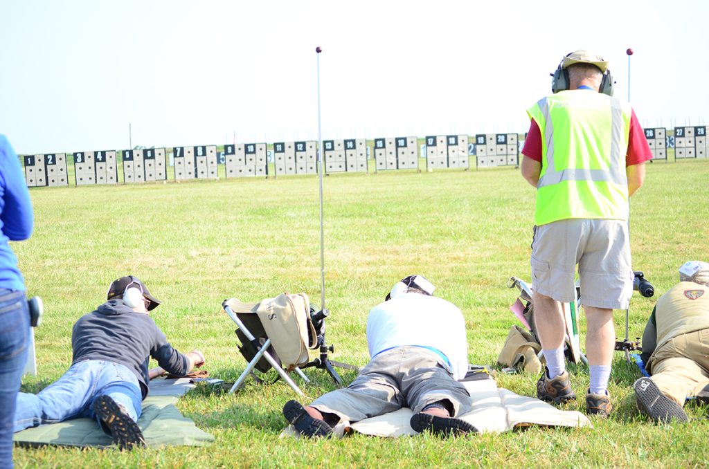 The M1 Carbine Match at Camp Perry is a relaxed, fun filled event with competitors shooting at 100 yards. Target backs are set up so competitors fire their targets, then score the targets after their relay has finished.