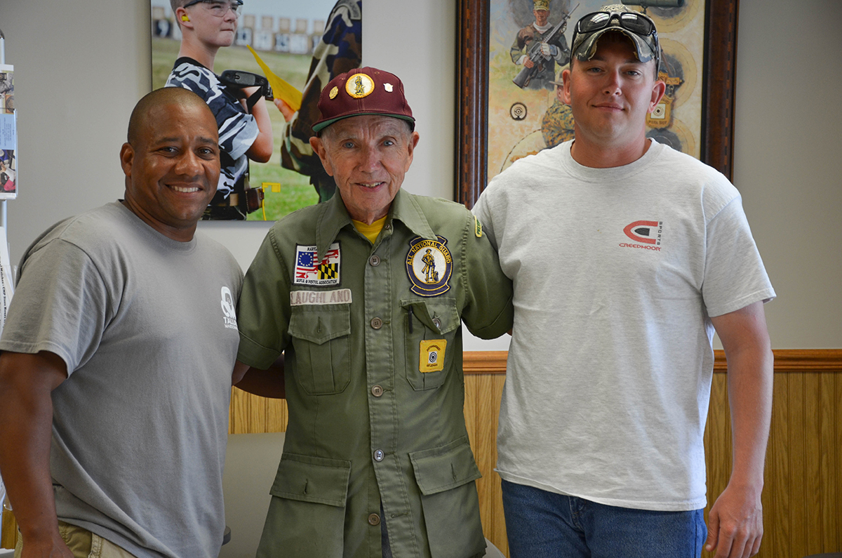 GySgt Luis Maceira (left) and M16 Match winner SSgt Josh Heckman (right) asked Jim for his autograph after spotting him in the CMP Headquarters office. Of course, Jim obliged.