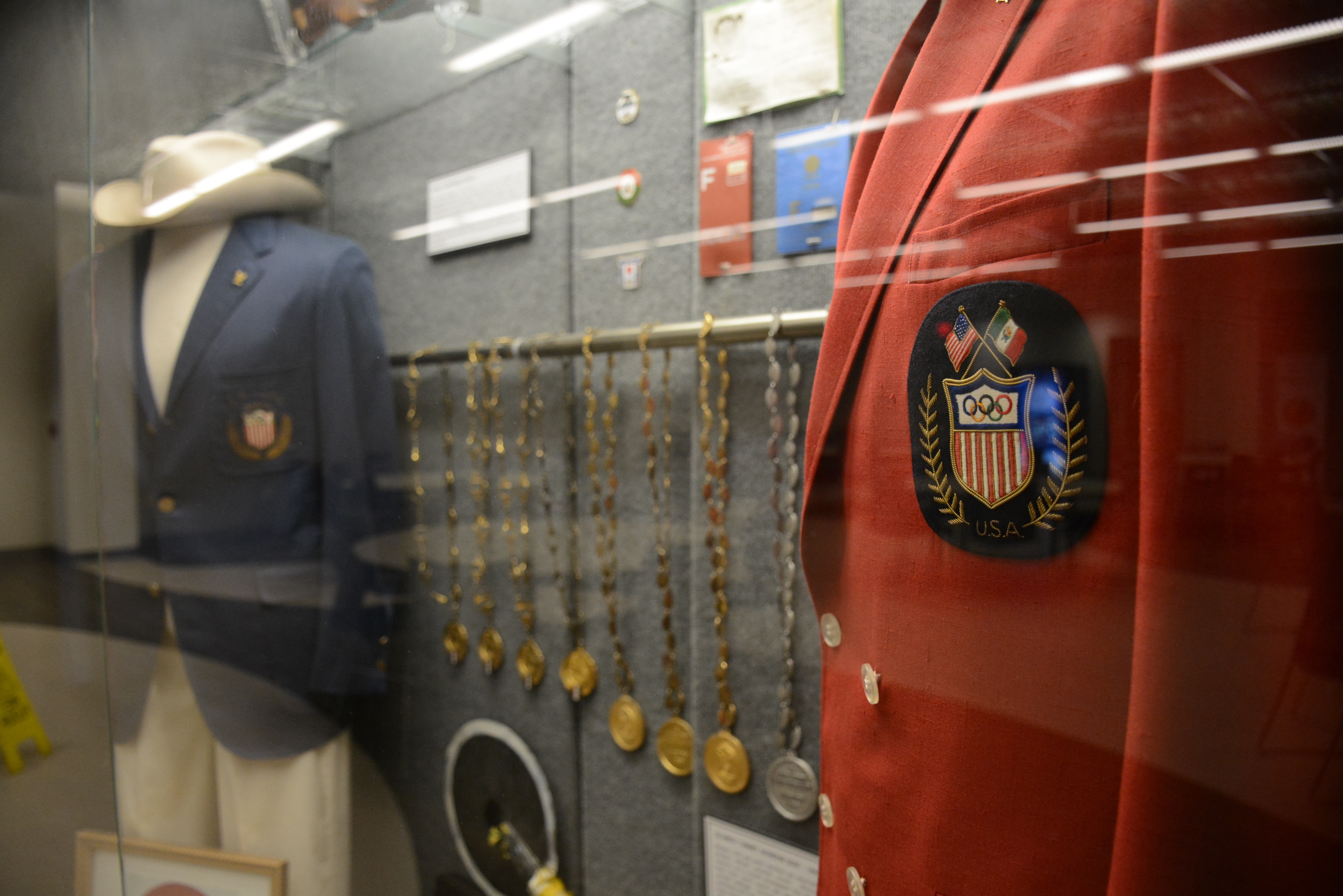 The Gary Anderson CMP Competition Center houses display cases filled with items from the astounding career of Gary Anderson – a two-time Olympic gold medalist. Among the many items are outfits worn by Anderson at the 1964 and 1968 Olympics, the Olympic torch he carried and handed to Muhammad Ali to light the main torch at the 1996 Games and the Olympic Order (the highest honor) awarded to Anderson by the International Olympic Committee in 2012.