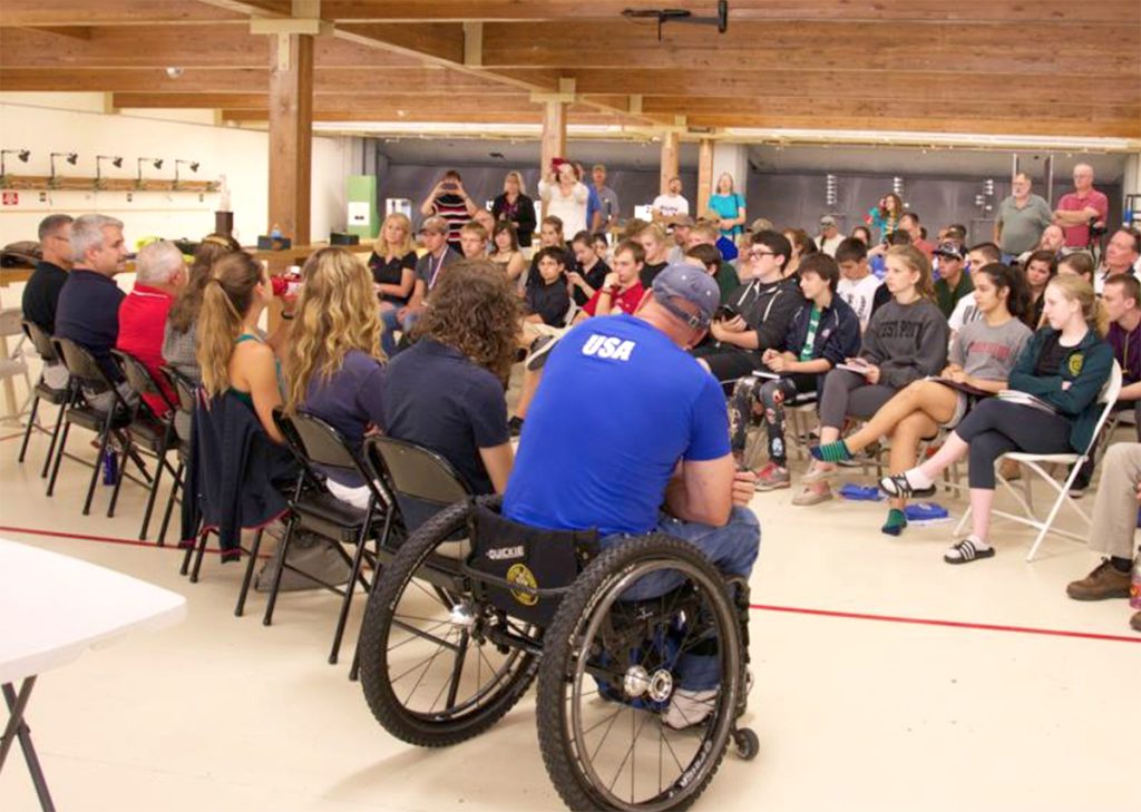 Ginny (front facing row, far right) attended one of the CMP’s Summer Standing Camps in Colorado Springs in 2013. There, she had the opportunity to hear from a panel of past Olympians.  