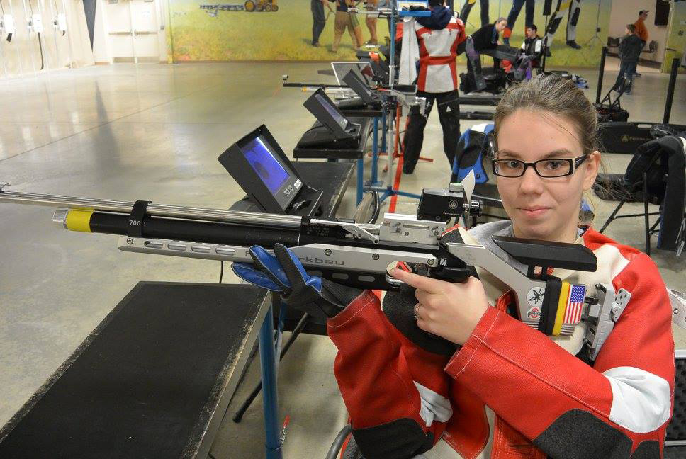 At first, without a jacket of her own, Taylor borrowed Greg’s for practice. Unfortunately, Greg’s jacket is designed for a right-handed shooter and Taylor is left-handed – not exactly as stabilizing at it should have been. Eventually, Taylor got a jacket of her own.