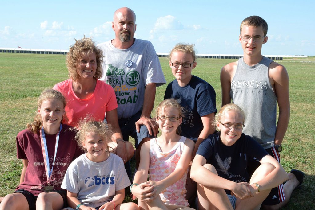 The McChesney Family Front, left to right: Judi, Julia, Heidi, Bria; Back, left to right: Sarah, Will, Cheri, Jimmy  