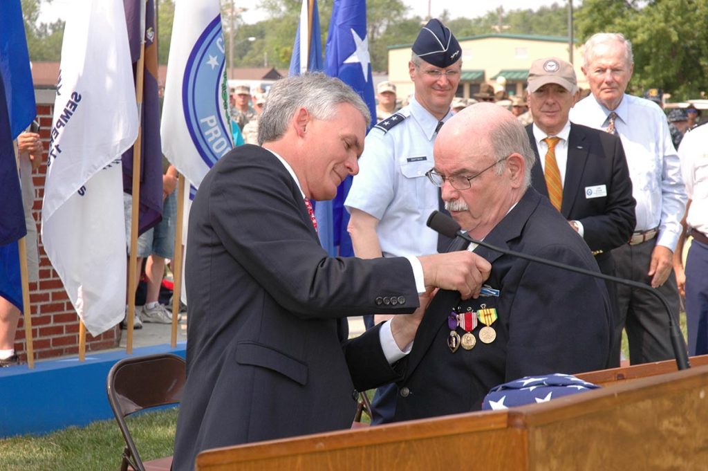 Congressman Robert Latta presented military medals to Vietnam war veteran, Mark Kovach.