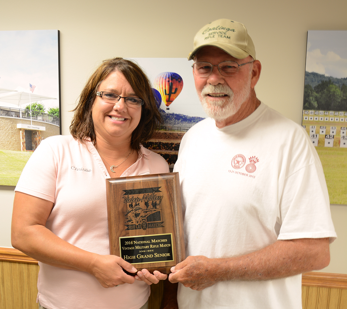 All the way from Chino Hills, CA, Michael Miller is presented his High Grand Senior Plaque by Christie Sewell, CMP Programs Chief.