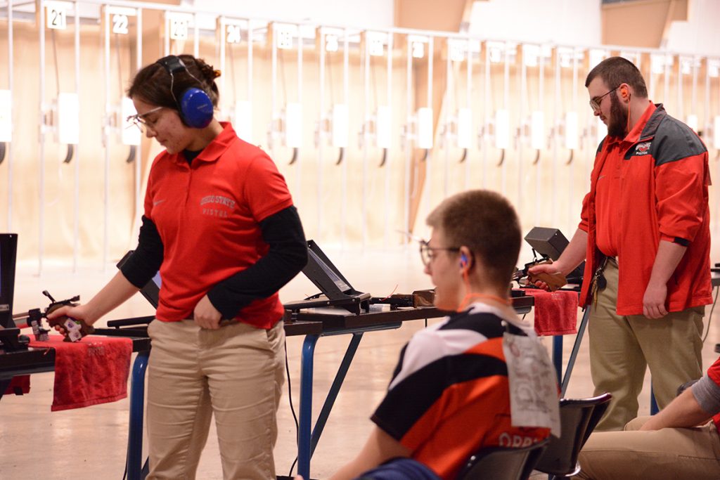 The Ohio State Varsity Pistol team earned the top spot in the Junior Pistol event, as teammates Glenn Zimmerman (right) received first place and Irina Andrianova (left) placed third in the individual junior competition. 