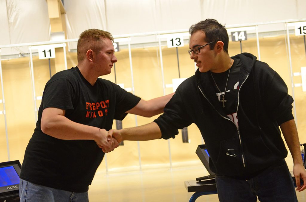Gabriel Palermo (left) shakes the hand of one of his finals opponents, Giovanni Gutierrez. Palermo set a new Navy JROTC 3x20 record and a new 3x20 plus final record with his outstanding score of 662-27x.  He was also the overall high marksman in the sporter competition.
