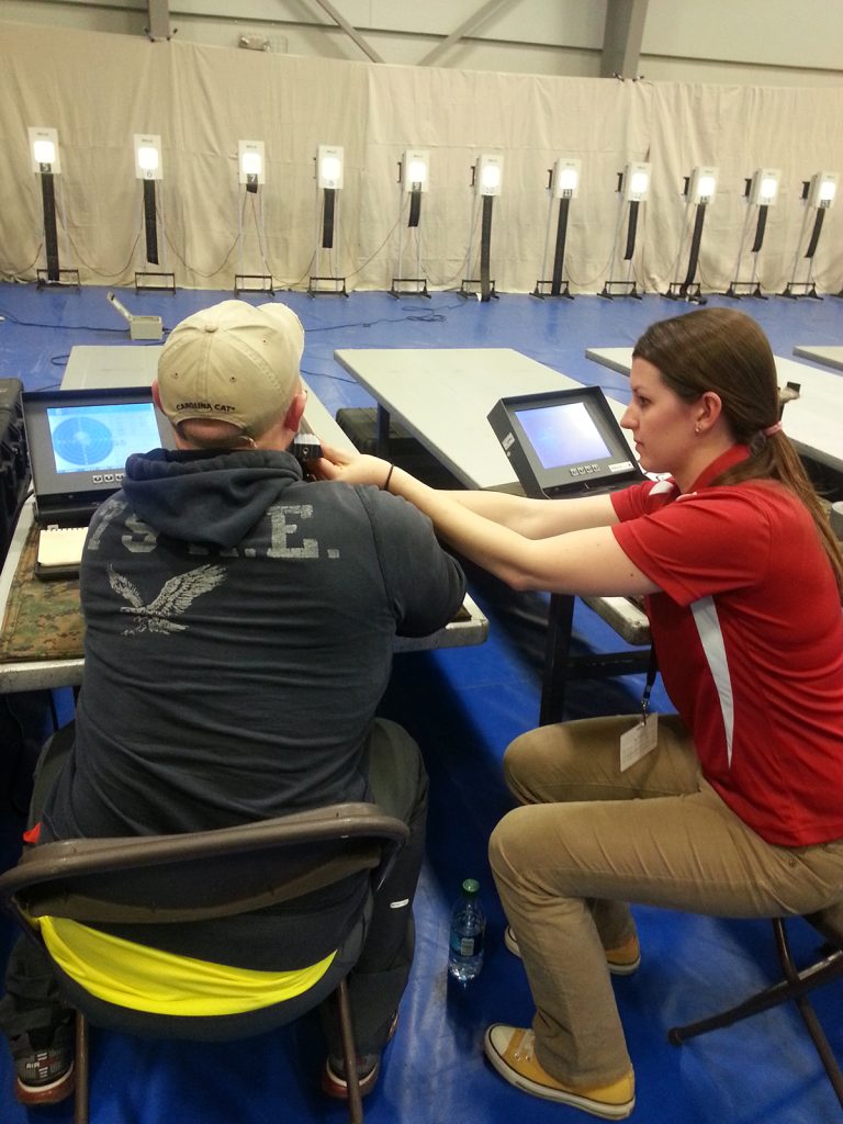 Besides providing the electronic targets, the CMP staff members also aide the athletes with air gun shooting. Ashley Jackson, right, assisted shooters on the line during the Marine Corps Wounded Warrior Trials at Camp Pendleton, Calif. 