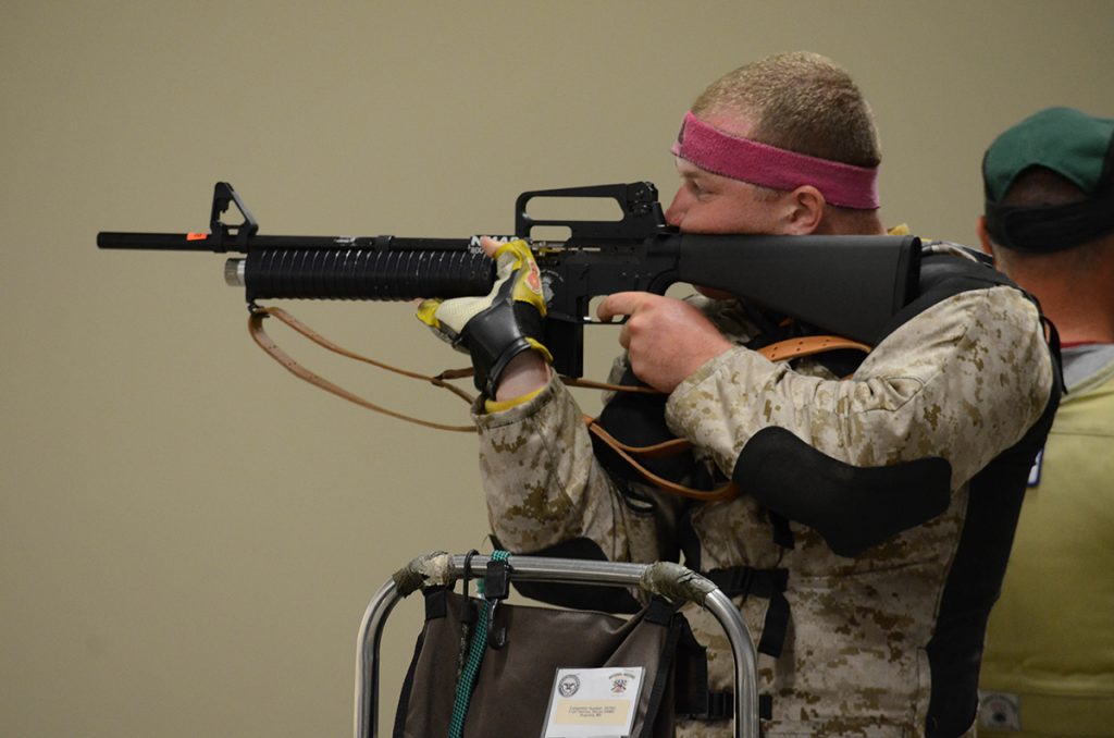 During the match, competitors fire National Match Air Rifles in a shoulder-to-shoulder elimination shoot off.