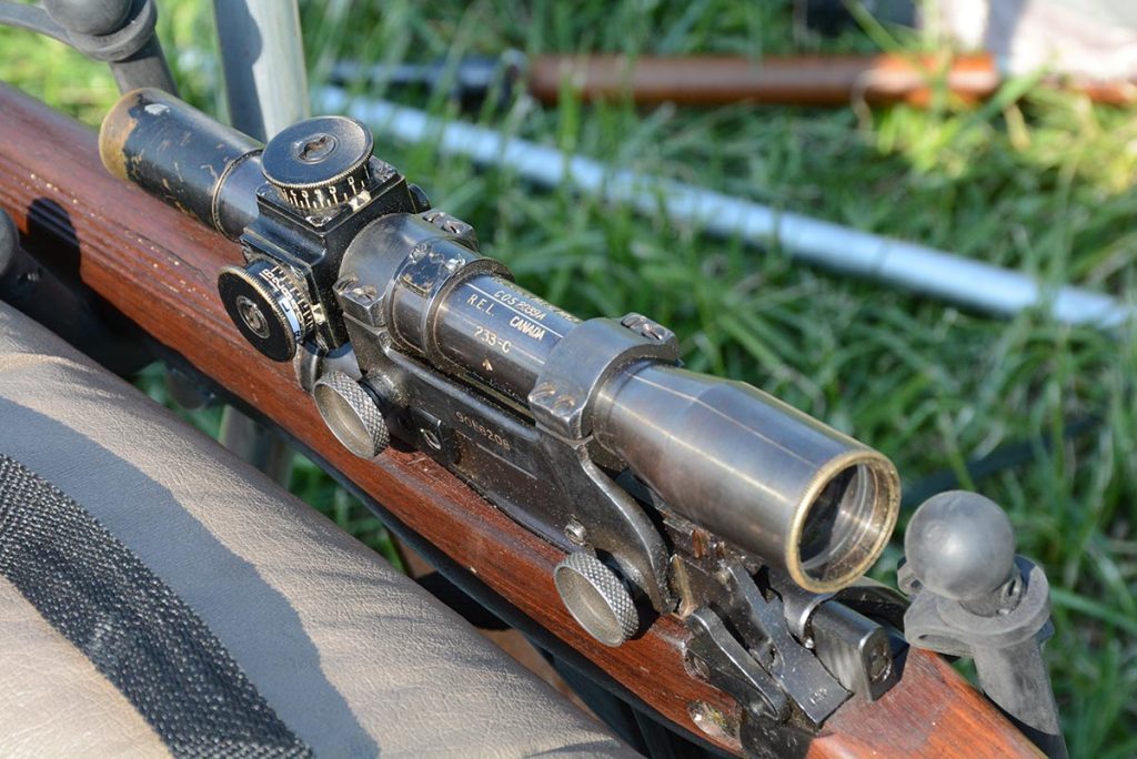 The firearm features a Canadian scope.