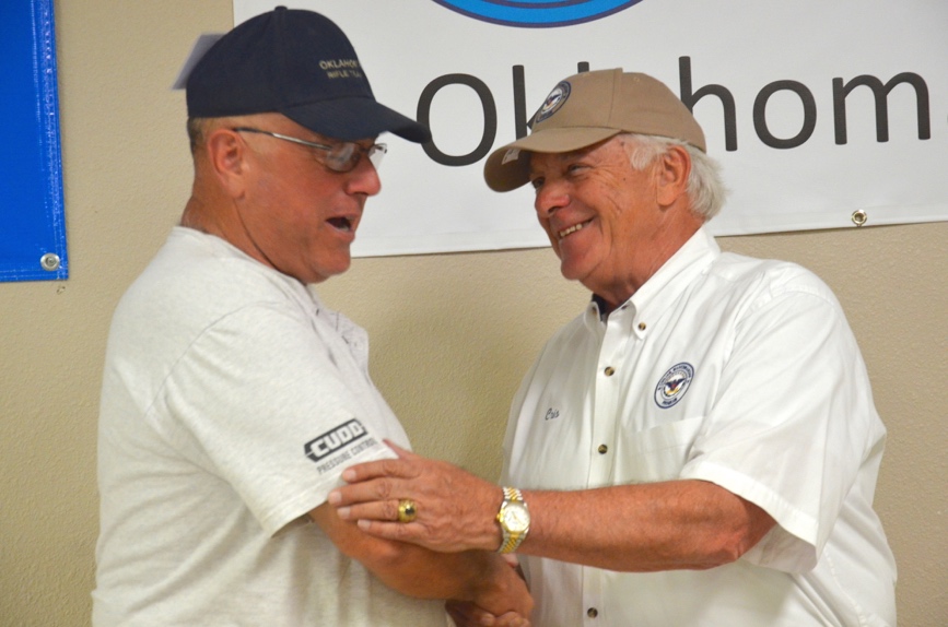 Mike Sexton is congratulated by CMP Board Vice Chairman Cris Stone after becoming a Distinguished Rifleman at the conclusion of the Service Rifle EIC Match. Sexton earned 10 EIC points, fulfilling his quota of 30 points to earn the honor.