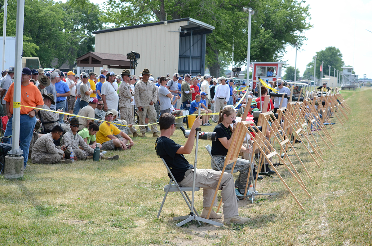 The Top 20 competitors of the President’s Match compete in a Shoot Off to determine the overall winner. Scorers mark each shot on giant targets facing the crowd to keep everyone involved in the event.