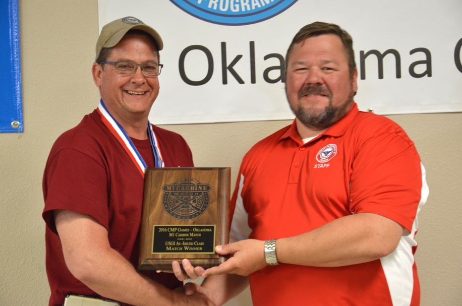Robert Spurrier topped all 100 M1 Garand shooters with an outstanding 290-3x total score. He is congratulated by CMP Chief Operating Officer Mark Johnson. Spurrier also was the winner of the M1 Carbine Match.