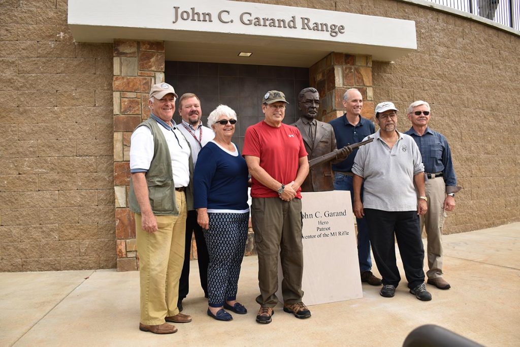 CMP Board Members and GCA representatives stand in front of the new John C. Garand statue near the 600 yard range at Talladega Marksmanship Park. The statue was donated to the CMP by the GCA.