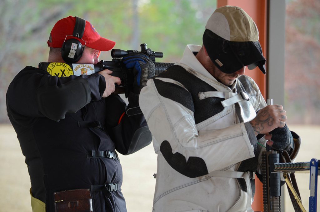 Robert Taylor (seen here firing with Fisher) is currently the coach for the California Grizzlies junior team and also shoots for the California state team.