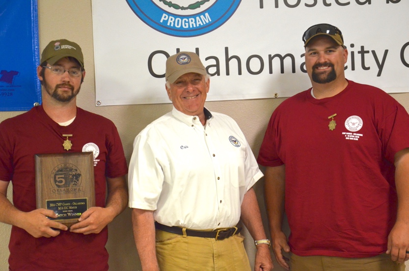 Taylor Davis, left, was the high scoring SAFS M16 EIC Rifle Match points leader among eligible competitors. Barrett Kilgore, right, also earned his introductory leg points in the match. They were congratulated by CMP Board vice chairman Cris Stone.