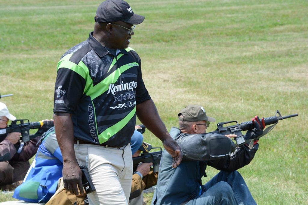 Members of the Remington-Bushmaster team instruct students on the firing line using dry-fire tactics during the Advanced Highpower Clinic. 