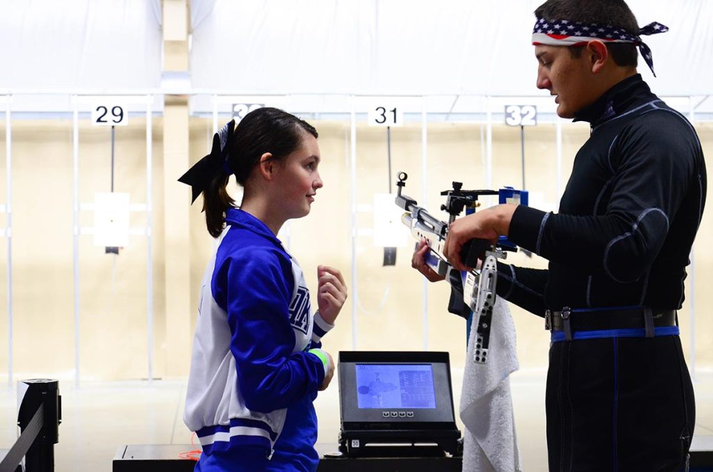 Tyler Thompson of the Ottawa County 4-H Shooting Stars air rifle team taught the students a little about the world of competitive shooting. Here, he shows Hannah Polanco of Danbury how to hold the rifle.